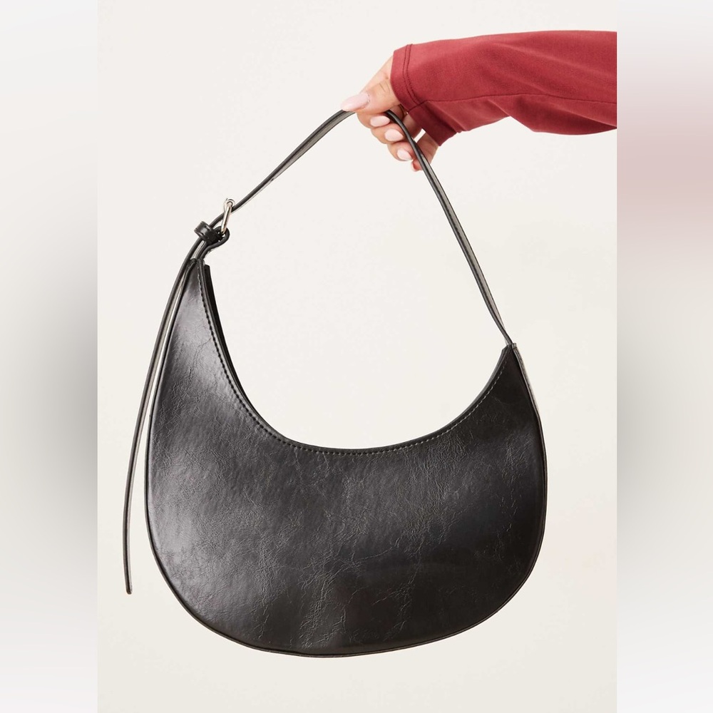 ASOS DESIGN asymmetric scoop shoulder bag with buckle detail in black